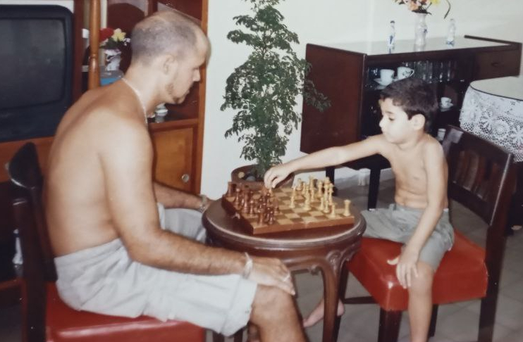 Andy playing chess as a kid